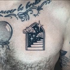 a man's chest with an open window and stars on it