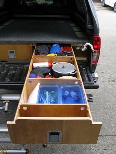 the back end of a truck with its drawers open