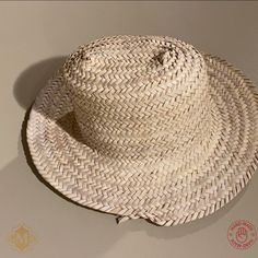 This Straw Hat sun are 100% handmade by artisans in Northern Morocco. and has been completely handmade. The dried palm leaf hat made from wild palm leavesare by free hand, with the straw Hat Natural palm. This Hand-Woven straw hats. Perfect for sunning your buns but keeping your pretty face shaded this summer! Features : Material : Harvested from the Doum palm Color : As Picture Size: Approx. 40 to 50 cm / 15.7 to 19.6 Inches Shap : Rounded Brand : Grand Moroccan Bazaar Condition : New Ethnic and traditional look Can be reshaped when wet. Ideal for the beach or working in the garden, a decoration on the wall. NOTE : Due to the nature of artisanship, a small variation in color, size, or design may occur. which make them even more beautiful and charming. Artisan Handwoven Summer Straw Hat, Bohemian Palm Leaf Boater Hat With Short Brim, Artisan Woven Straw Hat For Summer, Bohemian Short Brim Boater Hat, Traditional Fedora Panama Hat For Summer, Woven Palm Leaf Boater Hat, Handwoven Palm Leaf Brimmed Boater Hat, Handwoven Palm Leaf Boater Hat, Handwoven Natural Fiber Straw Hat