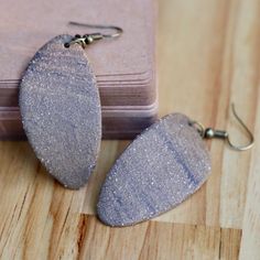 Elevate your accessory game with our exquisite handmade ceramic earrings. These unique clay earrings are perfect for anyone looking to treat yourself, or looking for a great gift. The geometric minimalist design makes these earrings a stunning match for any outfit. Lightweight feel and stylish, these earrings are a must-have addition to your jewelry collection. Small Batch: We make these earrings in batches of roughly 25 at a time, per color, per shape. Handmade: These earrings are made of real fired ceramic, by our hands, every week. Please keep in mind this means each individual earring will have very slight variations in size, shape and color. We think this is part of the charm and character each pair has, and imagine you do as well. Hypoallergenic: The earring hardware that we use is a Minimalist Resin Earrings For Gift, Clay Jewelry With Matching Earrings For Gift, Clay Drop Earrings As Gift, Clay Drop Earrings For Gift, Gift Clay Drop Earrings, Nickel-free Clay Jewelry For Everyday Wear, Minimalist Handmade Resin Earrings, Handmade Minimalist Resin Earrings, Minimalist Polymer Clay Earrings As Gift