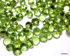 some very pretty green beads on a white surface