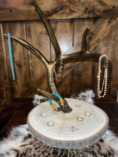 the antler is adorned with beads and chains