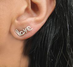 "Love Stud Earrings in Silver, Stuffing Stuffer, Word Earrings, Personalized Earrings, Silver Love Earrings, Custom Name Earrings, Heart Stud Earrings, Christmas Gift The dainty \"love\" word and \"heart symbol\" are super adorable for all-day, everyday wear. Each earring is hand-crafted, hammered, and hand polish for a brilliant shine. The Heart is approximately 5 mm long \"Love\" is 10 mm long ♥As a jewelry designer, and committed to my faith, I reserve the right to NOT create any words with ( Cute Dangle Earrings For Anniversary, Cute Hypoallergenic Earrings For Anniversary, Cute Nickel Free Earrings For Anniversary, Cute Silver Earrings For Anniversary, Cute Nickel-free Earrings For Anniversary, Earrings Word, Personalized Earrings, Word Earrings, Love Word