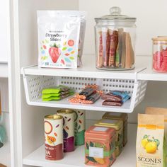 the shelves are filled with different types of snacks