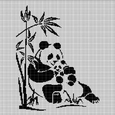 a cross stitch panda bear sitting on the ground next to a bamboo tree and eating