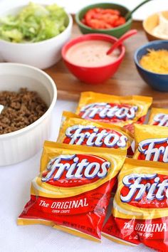 chips and dips are laid out on a table