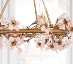 a chandelier with pink flowers hanging from it