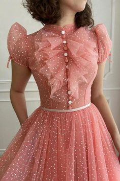 This peachy dotted tulle fabric is perfect for a blouse in a close fitting with jabot collar, front buttons in white and peach colors. The short puffed sleeves give it a touch of femininity, while the wide dress with gathering as a full circle skirt is perfect for twirling on the dance floor. The decorative ribbon belt adds a finishing touch to this gorgeous dress. Jabot Collar, Dress Polkadot, Teuta Matoshi, Wide Dress, Orange Outfit, Ribbon Belt, Prom Dress Inspiration, Floral Dresses Long, Full Circle Skirts