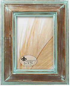 an old wooden frame with a fleur de lis logo on it