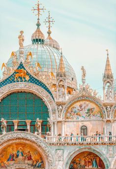 an ornate building with many paintings on it