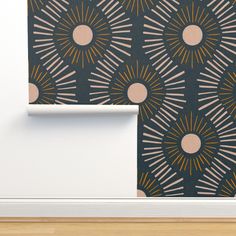 the wall paper is designed to look like an art deco design with sunbursts