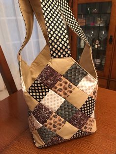 a purse sitting on top of a wooden table