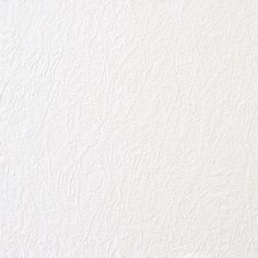 a white wall that has some kind of textured paint on it and is painted in different colors