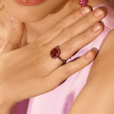 A dramatic ring in 18 karat gold with black rhodium centers a 5.09 carat cushion cut rubellite tourmaline accented with 1.58 total carats of round brilliant cut red spinels. Reference Code: 30198 Shop other beautiful pieces in our Ring Collection For inquiries on the piece please contact: boutique@shsilver.com Luxury Red Ruby Ring With Gemstone Accents, Luxury Red Cushion Cut Ruby Ring, Red Spinel Ring, Red Spinel, Spinel Ring, Rubellite Tourmaline, Ring Collection, Black Rhodium, Ring Collections