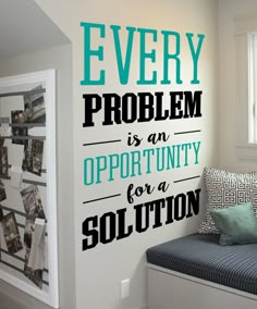 a bedroom with a bed, window and wall decal on the wall that says every problem is an opportunity for a solution