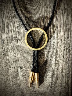 Handmade Western Style Gold Jewelry, Western Style Gold Lariat Jewelry, Handmade Western Gold Jewelry, Adjustable Artisan Yellow Gold Jewelry, One Of A Kind Adjustable Western Jewelry, Handmade Elegant Bolo Ties As A Gift, Handmade Elegant Bolo Ties For Gift, Modern Bolo Tie, Gold Adjustable Round Lariat Necklace