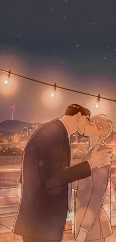 a man and woman kissing in front of a cityscape with lights strung above them