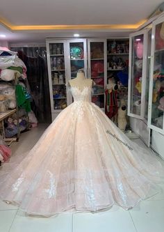 a wedding dress on display in a store