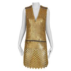 Never worn Paco Rabanne Gold chain link sleeveless cocktail dress. New with tag. In excellent condition. Fit size 4-6 Luxury Gold Sleeveless Dress, Luxury Sleeveless Mini Dress For Party, Gold Embellished Sleeveless Mini Dress, Summer Chainmail Dress, Fitted Chainmail Dress For Evening, Elegant Chainmail Dress For Night Out, Fitted Chainmail Dresses For Evening, Gold Sleeveless Mini Dress For Formal Occasions, Glamorous Evening Dresses With Chainmail