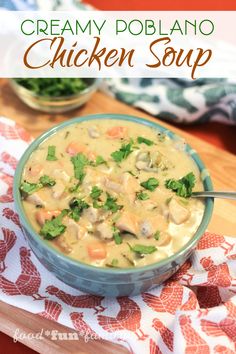 creamy poblaano chicken soup in a blue bowl on a red and white napkin