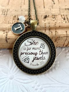 "She is far more precious than jewels, Bible Verse Necklace, Scripture Necklace, Personalized Christian gifts, Monogram necklace These beautiful necklaces are a perfect gift for mom, grandma, daughter, sister, friend or for you! it comes with an initial of your choice. ( A to Z). *Quote Reads: \"She is far more precious than jewels.\" Proverbs 3:15 Pendant Size is 35 mm, with a glass dome image 25mm.  The pendant colour is Bronze and the chain is also bronze colour. Initials are enamel black wit Bohemian Engraved Necklaces For Blessings, Sisters In Christ Jewelry, Bible Necklace, Verse Necklace, Christian Jewelry Necklaces, Bible Verse Necklace, Bible Verse Jewelry, Bronze Colour, Necklace Christian