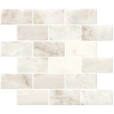 a white marble tile wall that looks like it is made out of tiles