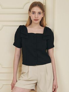 This is a minimal and feminine top by MICANE that is made out of high quality and sturdy fabric. With trendy design detail and refined mood, you can style it for your refined and casual daily outfit.- Minimal and daily mood- Semi cropped silhouette with losoe fit- Soft and light texture of fabric Chic Workwear Top In Solid Color, Chic Solid Color Tops For Work, Chic Solid Color Workwear Tops, Chic Spring Office Top, Chic Summer Office Tops, Solid Padded Blouse Tops For Workwear, Modern Business Casual Summer Blouse, Feminine Tops For Work In Solid Color, Feminine Solid Color Tops For Workwear