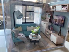 a dollhouse living room with furniture and decor