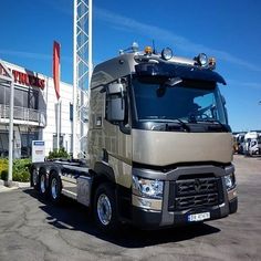 a large truck parked in front of a building