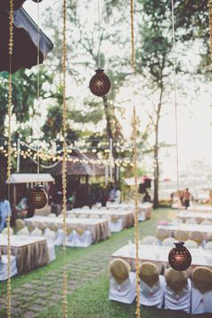 tables and chairs are set up for an outdoor wedding