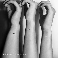 three wrist tattoos with butterflies on each arm and one butterfly on the left side of the forearm