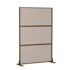 a brown metal screen with white circles on it