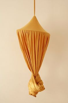 a yellow umbrella hanging from the ceiling