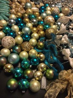 a pile of christmas ornaments sitting on top of a table