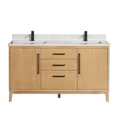 the double sink vanity has two black faucets on it's sides and is made out of wood