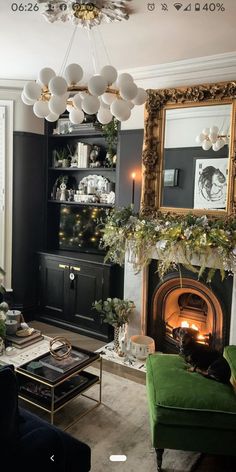 a living room filled with furniture and a fire place under a mirror on the wall