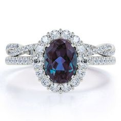 an oval shaped blue and white diamond ring