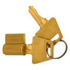 a gold colored key lock with two keys attached to the front and back of it