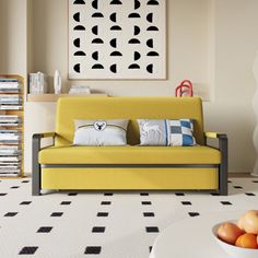 a living room with yellow couches and black and white floor tiles on the floor