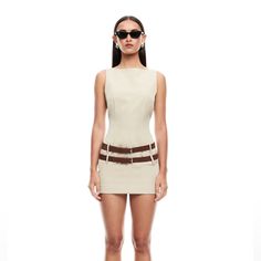 Product Features Buckled Beauty. Ethereal Buckle Mini Dress Features: Item Runs True To Size Boat Neckline Removable Double Belts Belt Loops Invisible Zip Closure 95% Polyester 5% Elastane Model Wears Size S And Is 177cm Belted Mini Dress For Cocktail, Belted Mini Dress For Day Out, Chic Beige Sleeveless Cocktail Dress, Beige Mini Bodycon Dress For Summer, Belted Mini Dress For Summer Cocktail Parties, Belted Mini Dress For Summer, Spring Fitted Belted Dresses, Fitted Belted Spring Dress, Beige Sleeveless Sheath Dress For Summer