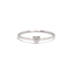 Engrave your initial with a loved ones initial onto this modern tiny heart ring. It's perfect as a couples and friendship gift. Please write the 2 initials you would like to engrave on the Notes box in the Shopping Cart. .925 Sterling Silver Laser Engraving Hypoallergenic, lead and nickel free Heart Height 3.5mm Band 1mm #R108 Heart Couple, Jewelry Gift Guide, Moms Bracelet, Choker Pendant, Yellow Gemstones, Studded Necklace, Gold Statement Ring, Nose Jewelry, Tiny Studs