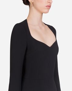 Thanks to its feminine shape and plunging sweetheart neckline, this stretch viscose cady dress adds sensuality to the woman who wear it. Long sleeves Stretch silk satin lining Rear zipper and hook-and-eye fastening The piece measures 65 cm - 25.6 inches from the waist down on a size IT 40 The model is 175 cm - 68.9 inches tall and wears a size IT 40 Made in Italy Fitted Bodice Dress With Invisible Zipper, Fitted Mini Dress With Open Neckline For Evening, Fitted Dress With Open Neckline For Cocktails, Formal Long Sleeve Mini Dress With Fitted Bodice, Black Fitted Dress With Open Neckline, Designer Long Sleeve Fitted Mini Dress, Classic Long Sleeve Dress With Structured Boning, Evening Dress With Structured Boning And Long Sleeves, Fitted Dress With Open Neckline For Formal Occasions