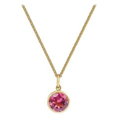 Handcrafted 1.30 Carats Pink Tourmaline 18 Karat Yellow Gold Pendant Necklace. The 7mm natural stone is set in our iconic hand pierced gold lace to let the light through. Our pendants are the ideal gift. Here presented on our finely knitted gold chains. Chain is included in the price, its length is 17 inches adjustable at 16 inches. Pendant measures 8mm diameter. Choose from our selection of precious stones and fine gems to fit ones birthstone or favorite color. Our lace on the reverse allows natural light through its structure revealing the true natural beauty and color of our stones. A hidden diamond on the back rests against your soul. Here presented on our finely knitted gold chain. Chain is included in the price. Tourmalines are considered as the rainbow of gems for their exciting col Formal Birthstone Necklace With 17 Jewels In Round Pendant, Classic Faceted Pendant Necklace, Fine Jewelry Round Faceted Necklace, Pink Round Pendant Necklace For Formal Occasions, Formal Pendant Birthstone Necklace, Formal Pink Round Pendant Necklace, Fine Jewelry Hallmarked Necklaces With Round Stone, Yellow Gold Faceted Round Pendant Necklace, Faceted Yellow Gold Round Pendant Necklace