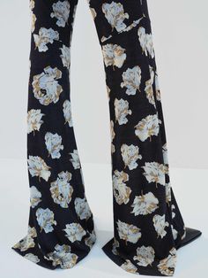 MO&Co. Noir Women's Floral Printed Flared Pants Indulge in comfort and style with our pants. Made with stretchy fabric for maximum comfort, featuring a high-waisted flare design and practical side pockets. The beautiful floral print adds the perfect touch of femininity to your wardrobe. Features : - High waist flared leg, comfy stretchy- Slanted pockets, hook-and-bar closure- Floral printed design Code: MBD1PAT034The back length of size M is 110cmMATERIALS & CARE Material: 94.4% Viscose 5.6% Spa High Waisted Flares, Flared Pants, Back To Black, Printed Design, Floral Printed, Stretchy Fabric, Flare Pants, Full Length, High Waist