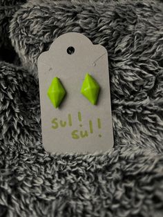 Sul Sul Internet!  are you a gamer, particularly like simulator games?  Ever  heard of the Sims, if so then check out these cute earrings inspired off of their Diamonds hovering over their heads.  materials:  polymer clay, steel stud earrings  (molding, baking and cooling process)  Time: 10 mins Green Plastic Earrings For Gifts, Air Dry Clay, Cute Earrings, Sims 4, Polymer Clay, Etsy Earrings, Stud Earrings, 10 Things