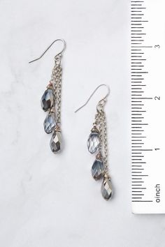 Discover the beauty and versatility of the Reflections Collection! Every piece is meticulously handcrafted with carefully selected materials. These tassel earrings perfectly complement the collection, adding an elegant touch to your style. Elevate your look with Reflections! Antique Silver Plated Brass (Lead & Nickel Free) Crystal 2.5" with sterling silver ear wires We hand select our natural materials, thus there may be slight variations in color and/or size that will not detract from the overa Elegant Beaded Dangle Earrings With Tassels, Elegant Handmade Long Drop Tassel Earrings, Elegant Long Drop Handmade Tassel Earrings, Elegant Faceted Beaded Drop Earrings, Elegant Handmade Tassel Drop Earrings, Elegant Teardrop Tassel Earrings, Elegant Silver Tassel Earrings With Dangling Beads, Faceted Metal Dangle Earrings, Elegant Adjustable Faceted Crystal Earrings