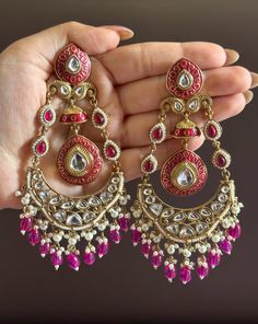 Statement earrings for a statement look! These handmade high quality kundan polki and meenakari earrings in stunning magenta  and gold are a unique addition to your outfit to glam it up! These can be paired with both Indian and western outfits. They are also extremely lightweight because they are handcrafted. Easy on your ears and beautiful for the eyes 💖 For any queries, please reach out to us. Happy shopping! Pink Round Chandelier Earrings For Wedding, Pink Chandelier Earrings For Wedding, Pink Hand Set Chandbali Bridal Earrings, Fusion Style Chandelier Earrings For Wedding, Tilla Bridal Dangle Earrings For Wedding, Intricate Design Chandbalis For Wedding, Purple Kundan Earrings For Wedding, Pink Jhumkas Drop Earrings For Wedding, Traditional Kundan Purple Earrings