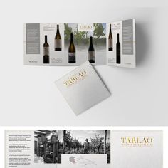 an open brochure with wine bottles on the front and back cover, in black and white