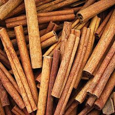 cinnamon sticks are piled on top of each other