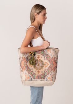 A classic bohemian tapestry tote bag with embroidered detail throughout. Tapestry tote bag Embroidered detail Suede leather double strap handles Magnetic closure Inner zip pocket Tassel accent Bohemian tote bag Inspired by some of our favorite vintage bags, our large-sized tote features a beautiful tapestry design and embroidered details throughout. Featuring double suede straps for easy carrying. Dimensions: H 18" x W 20" x D 6 5/8"Style: DR-904-1 Tote Bag Embroidery, Beautiful Tapestry, Boho Tote Bag, Boho Tote, Boho Tapestry, Bohemian Tapestry, Travel Tote Bag, Embroidered Details, Embroidered Bag